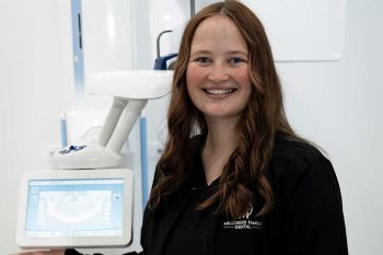 Millcreek Family Dental team member showing the CBCT Imaging machine